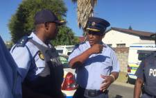 FILE: Western Cape police commissioner Lt Gen Khombinkosi Jula (right) chats to an officer. Picture: Monique Mortlock/EWN