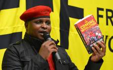 The EFF's Floyd Shivambu holds a copy of The Coming Revolution at the book's launch at the University of Cape Town on 10 July 2014. Picture: Aletta Gardner/EWN