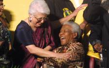 Former President Nelson Mandela shares a light moment with Ginwala at the end of the opening session of the ruling African National Congress's (ANC) 51st conference on 16 December 2002. Picture: Anna Zieminski/AFP