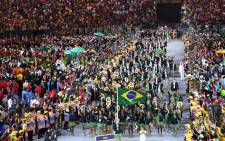 Brazilâs Yane Marques leads her delegation during the opening ceremony of the Rio 2016 Olympic Games at the Maracana stadium in Rio de Janeiro on 5 August, 2016. Picture: AFP.