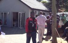 Staff at Tecino Trading in Sandown, stand outside the office after an armed robbery on 24 September 2012. Picture: Andrea van Wyk/EWN.