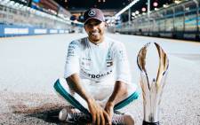 Mercedes' Lewis Hamilton poses with his trophy after winning the Singapore F1 Grand Prix. Picture: @MercedesAMGF1/Twitter