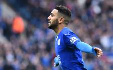 Leicester City’s Algerian midfielder Riyad Mahrez celebrates scoring the opening goal during the English Premier League football match between Leicester City and Swansea at King Power Stadium in Leicester, central England on 24 April, 2016. Picture: AFP.