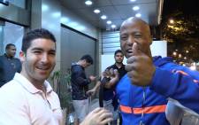 Jimmy Tau is welcomed by EWN Sport Marc Lewis upon his arrival in Rio de Janeiro on 1 July 2014. Tau will be working with EWN Sport to give his analysis and predictions. Picture: Christa Eybers/EWN.