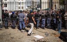 Police block UCT #FeesMustFall protesters outside of Parliament after clashes between officers and protesters broke out. Picture: Anthony Molyneaux/EWN.