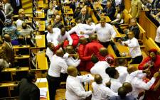 FILE: Security officials remove EFF members from the National Assembly after they disrupted President Zuma’s 2017 State of the Nation Address. Picture: AFP.