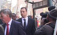 Oscar Pistorius arrives at the High Court in Pretoria on 1 July 2014 with his legal team for day 35 of his murder trial. Picture: Reinart Toerien/EWN."