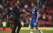 Chelsea's English head coach Frank Lampard (L) shakes hands with Chelsea's Spanish defender Cesar Azpilicueta on the pitch at the final whistle in the English Premier League football match between Manchester United on 11 August 2019.  Picture: AFP