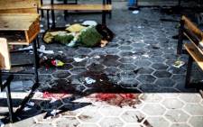 A trail of blood is seen in the courtyard of a UN School in the northern Gaza Strip after it was hit by an Israeli tank shell, 24 July 2014. At least 15 people were killed, including a baby. Picture: AFP.