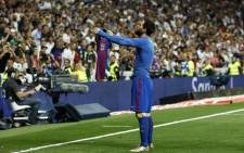 Barcelona’s Argentinian forward Lionel Messi celebrates after scoring during the Spanish league Clasico football match Real Madrid CF vs FC Barcelona at the Santiago Bernabeu stadium in Madrid on 23 April, 2017. Picture: AFP.