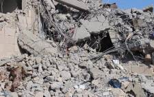 This AFPTV screen grab from a video made on 1 September 2019, shows a view of destroyed buildings in the aftermath of reported air strikes carried out by the Saudi-led military coalition against a Huthi military target in Dhamar, south of the capital Sanaa, in an attack the rebels said killed dozens of people. Picture: AFP.