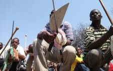Lonmin miners rest during a protest march, over wages. Picture: Taurai Maduna/EWN.