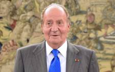 FILE: Spain's former King Juan Carlos waiting for Ecuador's President before a meeting at the Zarzuela Palace near Madrid on 24 April 2014. Picture: AFP.