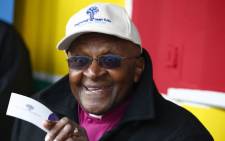 "South African Nobel peace laureate Archbishop Emeritus Desmond Tutu talks before reading to children on the occasion of Mandela Day in Cape Town, on 18 July 2014. Picture: EPA.
