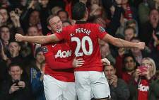 Manchester United's Robin Van Persie celebrates with team mate Wayne Rooney after scoring against Arsenal on 10 November 2013. Picture: Manchester United FC official Facebook page.