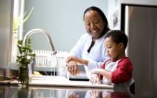 black-child-mother-parent-cleaning-kitchen-home-kids-familyjpg