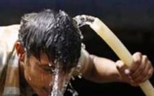 FILE: A screengrab shows a man cooling himself with water after heatwave. Picture: Supplied.