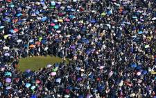 People gather at Victoria Park for a pro-democracy rally in Hong Kong on 8 December 2019. Hong Kong democracy protesters are hoping for huge crowds December 8 at a rally they have billed as a "last chance" for the city's pro-Beijing leaders in a major test for the six-month-old movement. Picture: AFP