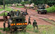 Soldiers of the Uganda People's Defence Force (UPDF) patrol in the northerneastern part of the Central African Republic to secure the area from rebel groups' possible attacks, on June 25, 2014. Picture: AFP. 