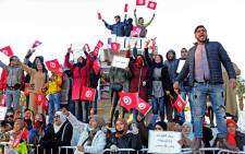 Unemployed Tunisian graduates chant slogans during a demonstration to mark the 11th anniversary of the start of the 2011 revolution, on 17 December 2021, in Sidi Bouzid, stronghold of the Tunisian revolution. Picture: ANIS MILI /AFP