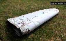 FILE: A screengrab of debris from missing Malaysia Flight 370 has been found in a remote Indian Ocean island.