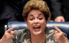 Brazilian President Dilma Rousseff attends a ceremony to renovate the leasing contract regarding the use of the Paranagua Container Terminal, at Planalto Palace in Brasilia, on 13 April, 2016. Picture: AFP.