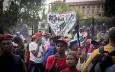 Protesters hold up a banner at the "Day of Action" march against the leadership of President Jacob Zuma held in Pretoria on 12 April 2017. Picture: Reinart Toerien/EWN