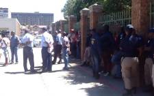Police monitor the situation outside the Boksburg Magistrates Court on 14 November 2014 after charges were withdrawn against Thamsanqa Twala. Picture: Mia Lindeque/EWN.