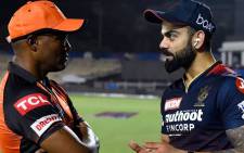Royal Challengers Bangalore's Virat Kohli (right) chats to former West Indies great and Sunrisers Hyderabad batting coach Brian Lara (left) on 23 April 2022. Picture: @RCBTweets/Twitter