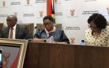 FILE: Telecommunications and Postal Services Minister Siyabonga Cwele (left) and Social Development Minister Bathabile Dlamini (centre) at a media briefing. Picture: EWN.