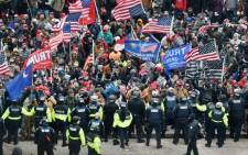 FILE: Trump supporters clash with police and security forces as they storm the US Capitol in Washington, DC on 6 January 2021. Donald Trump's supporters stormed a session of Congress held to certify Joe Biden's election win. Picture: AFP