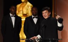 
Actor Jackie Chan accepts his award on stage during the 8th Annual Governors Awards hosted by the Academy of Motion Picture Arts and Sciences at the Hollywood & Highland Center in Hollywood, California on 12 November 2016. Picture: AFP