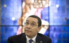 FILE. Romanian Prime Minister Victor Ponta is pictured during an interview with journalists at the Romanian Government headquarters in Bucharest on 9 June 2015. Hes to face trial for corruption, the country's anti-graft prosecutors said on 17 September 2015. Picture: AFP