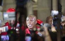 Julius Malema, leader of the Economic Freedom Fighters (EFF), speaks to members of the media after the EFF disrupted the State of the Nation Address and then decided to leave before South African President Cyril Ramaphosa delivered his address, at the opening of the South African Parliament in Cape Town on 13 February 2020. Picture: AFP