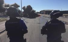 Police continue to monitor heavy the situation in Vrygrond in the wake of taxi violence which has seen four killed and community property damaged. Picture: Lauren Isaacs/EWN.