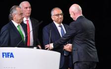 Fifa president Gianni Infantino (R) congratulates the United 2026 bid (Canada-Mexico-US) officials Carlos Cordeiro (C), president of the United States Football Association, president of the Mexican Football Association Decio de Maria Serrano (L) and Steve Reed (2nd L), president of the Canadian Soccer Association, following the announcement of the 2026 World Cup host during the 68th Fifa Congress at the Expocentre in Moscow on 13 June 13 2018. Picture: AFP