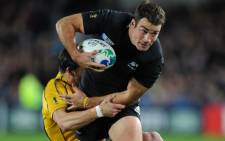 FILE: New Zealand All Black left wing Richard Kahui is tackled during the 2011 Rugby World Cup semifinal match Australia vs New Zealand at Eden Park Stadium in Auckland on 16 October 2011. Picture: AFP