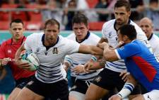 Italy's centre Tommaso Benvenuti (L) fends off a tackle during the Japan 2019 Rugby World Cup Pool B match between Italy and Namibia at the Hanazono Rugby Stadium in Higashiosaka on 22 September 2019. Picture: AFP