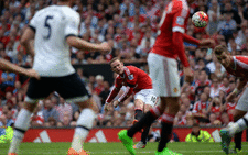 Manchester United's English striker Wayne Rooney (C) sends a free-kick over the bar during the English Premier League on 08 August, 2015. Picture: AFP.