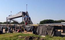 FILE: Miners blocking a bridge at Amplats Thembalani shaft, checking who is reporting for duty. Picture: Govan Whittles/EWN.