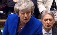 A video grab from footage broadcast by the UK Parliament's Parliamentary Recording Unit shows Britain's Prime Minister Theresa May as she speaks during the weekly Prime Minister's Questions in the House of Commons in London on 16 January 2019, ahead of a debate and vote on a motion of no confidence in the government. Picture: AFP