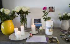 FILE: Photographs of Franziska Blchliger at various ages displayed alongside candles and flowers in the family's Cape Town home on 8 March 2016. Picture: EWN.
