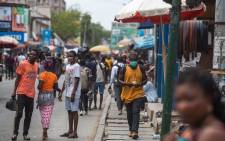 FILE: A man walks with a face mask at the Kantamanto market after the partial lockdown in parts of Ghana to halt the spread of the COVID-19 coronavirus was lifted in Accra, Ghana on 20 April 2020. Picture: AFP