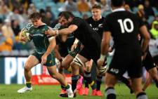 New Zealand's Sam Whitelock tackles Australia's Michael Hooper (L) during the Tri Nations and Bledisloe Cup rugby match between Australia and New Zealand in Sydney on 31 October 2020. Picture: AFP