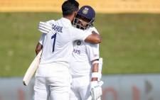 India's KL Rahul (L) celebrates with India's Ajinkya Rahane (R) after scoring a century (100 runs) during the first day of the first Test cricket match between South Africa and India at SuperSport Park in Centurion on December 26, 2021. Picture: AFP