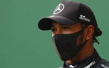 Mercedes' British driver Lewis Hamilton reacts after securing his 93rd pole position during the qualifying session at the Spa-Francorchamps circuit in Spa on 29 August 2020 ahead of the Belgian Formula One Grand Prix.Picture: AFP. 
