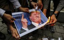 FILE: Iranians burn an image of US President Donald Trump during an anti-US demonstration outside the former US embassy headquarters in the capital Tehran  Picture: AFP