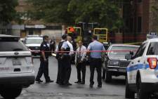 Chicago police officers and detectives investigate a shooting where multiple people were shot on Sunday, August 5, 2018 in Chicago, Illinois. Picture: AFP
