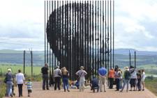 People pay their respects to Nelson Mandela at the site where he was arrested outside Howick in 1962. Picture: Reinhardt Hartzenberg/EWN.