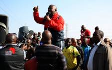 Expelled ANC Youth League President Julius Malema is seen addressing striking mineworkers at Lonmin's Marikana operations on Saturday, 18 August 2012. Picture: Sapa.
